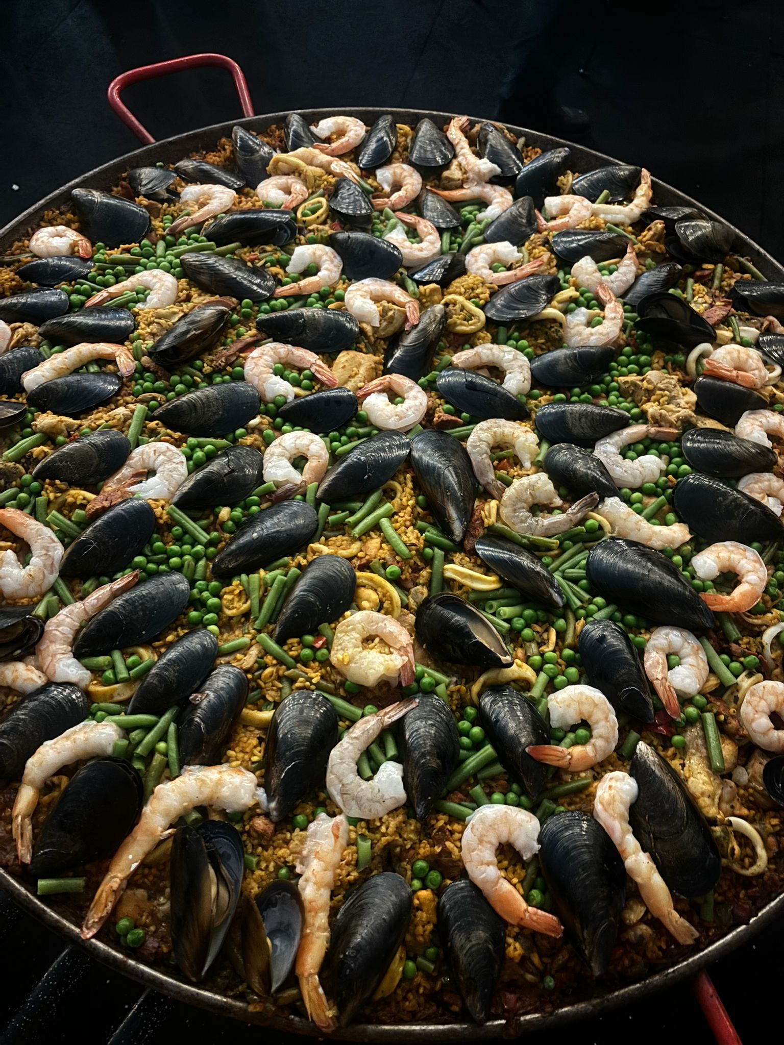 A freshly cooked seafood paella dish
